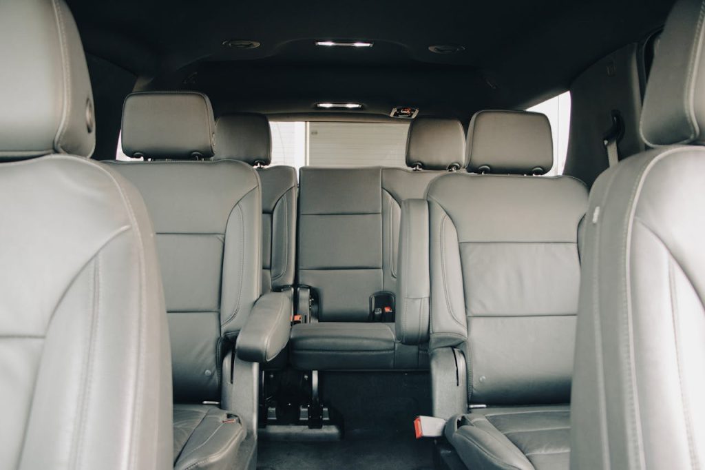 pexels-photo-15200595 Explore the luxurious empty leather seats of a modern car interior, showcasing spacious design and comfort.